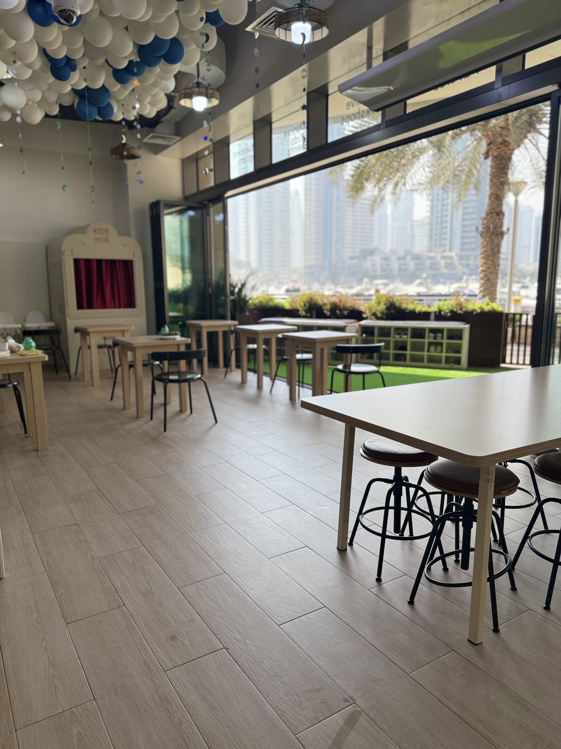 Kids Hub parent lounge with a view over Dubai Marina