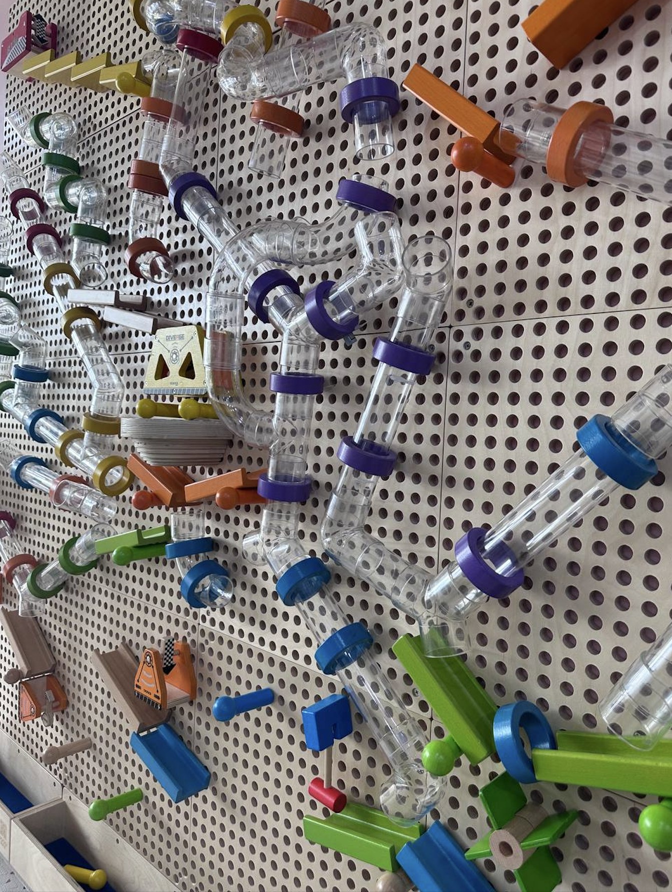 Pegboard marble run wall for hands-on play at Kids Hub